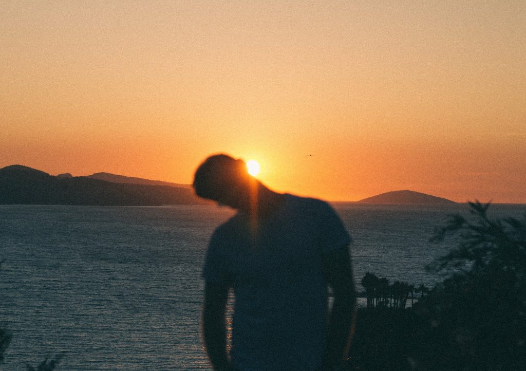 sunrise covered with mans head