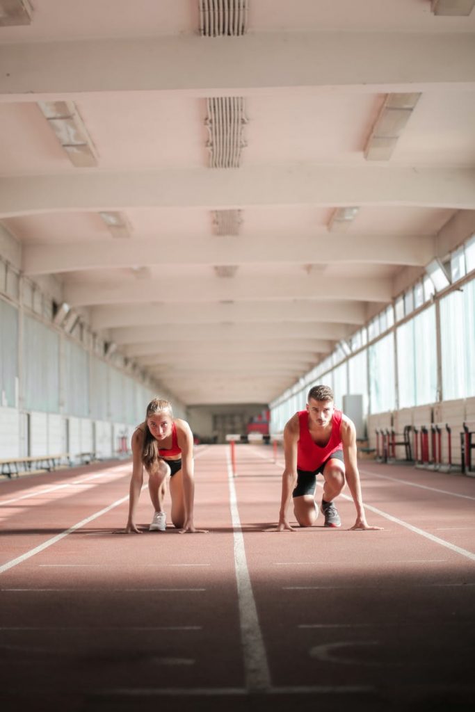 young athletes preparing for running in training hall