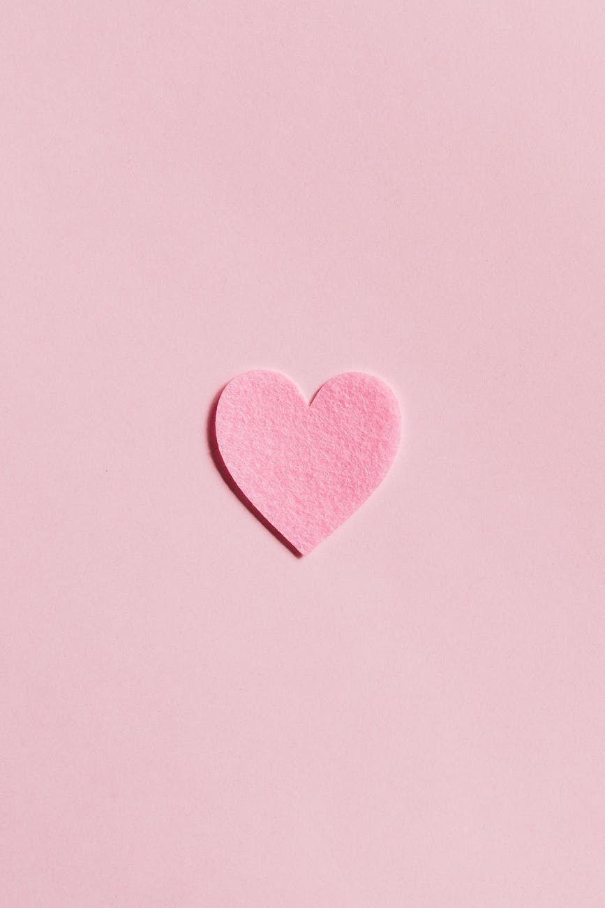 paper heart on light pink background