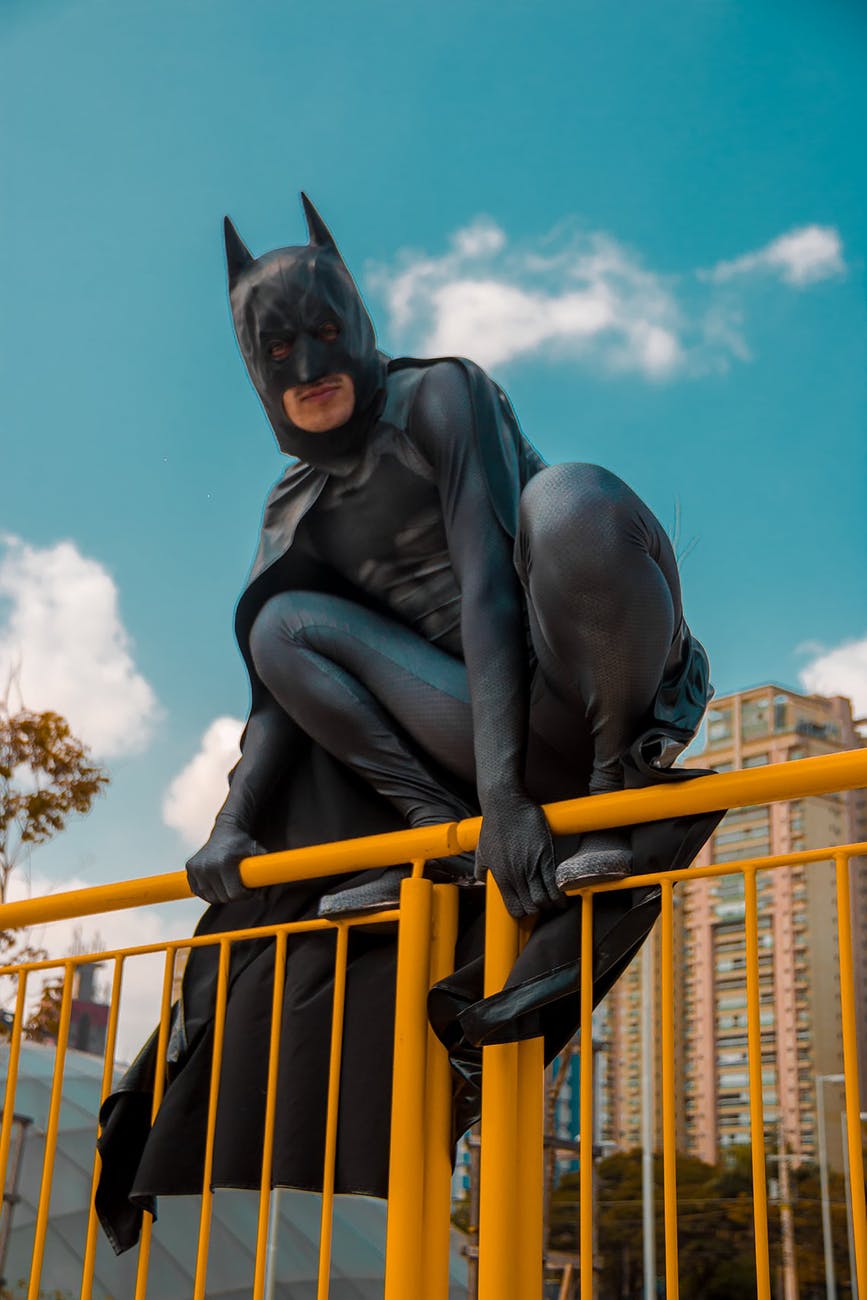 low angle photo of man wearing batman costume