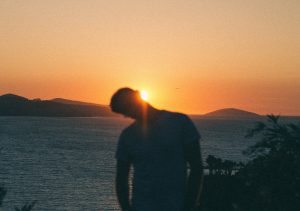 sunrise covered with mans head