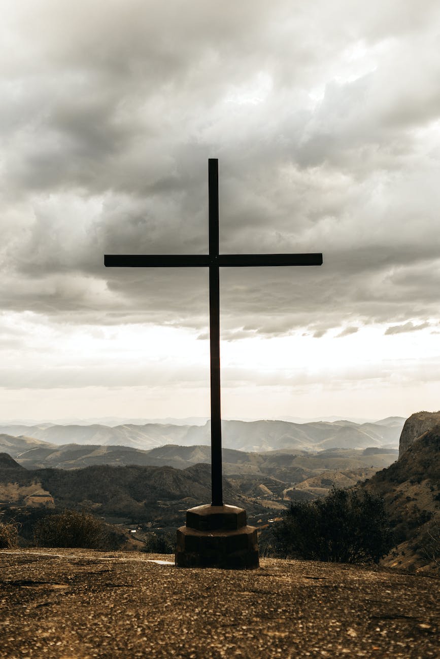 black cross on top of mountain