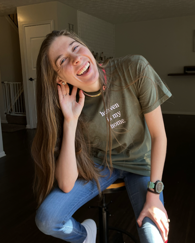 amber sitting on chair smiling
