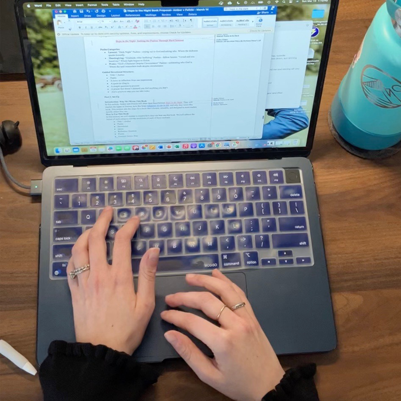 person typing on a computer
