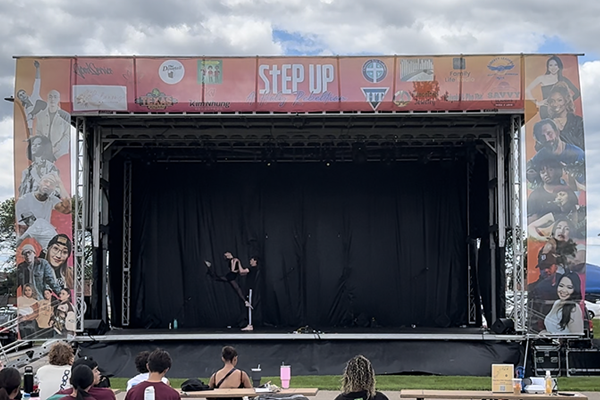 man and woman dancing on stage