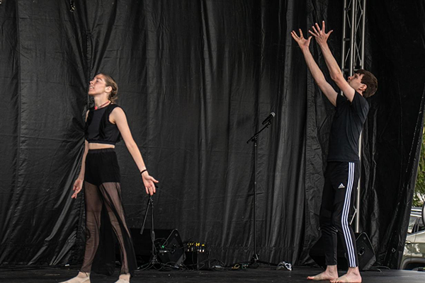 man and woman dancing on stage